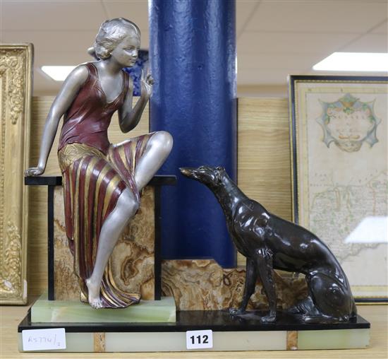 An Art Deco onyx and bronze spelter figure and dog group height 40cm